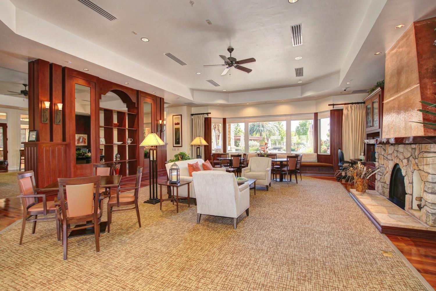 7409 Rothschild Court Elk Grove, CA 95757 - Photo 48 of 62 a living room with furniture and a fireplace