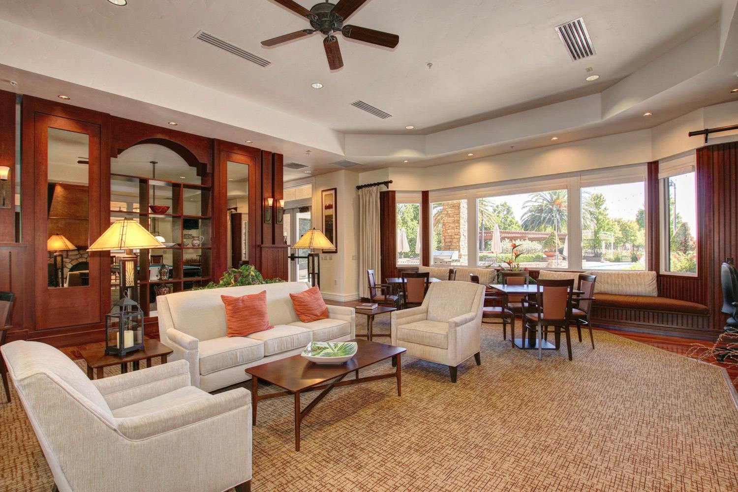 7409 Rothschild Court Elk Grove, CA 95757 - Photo 49 of 62 a living room with furniture and a large window