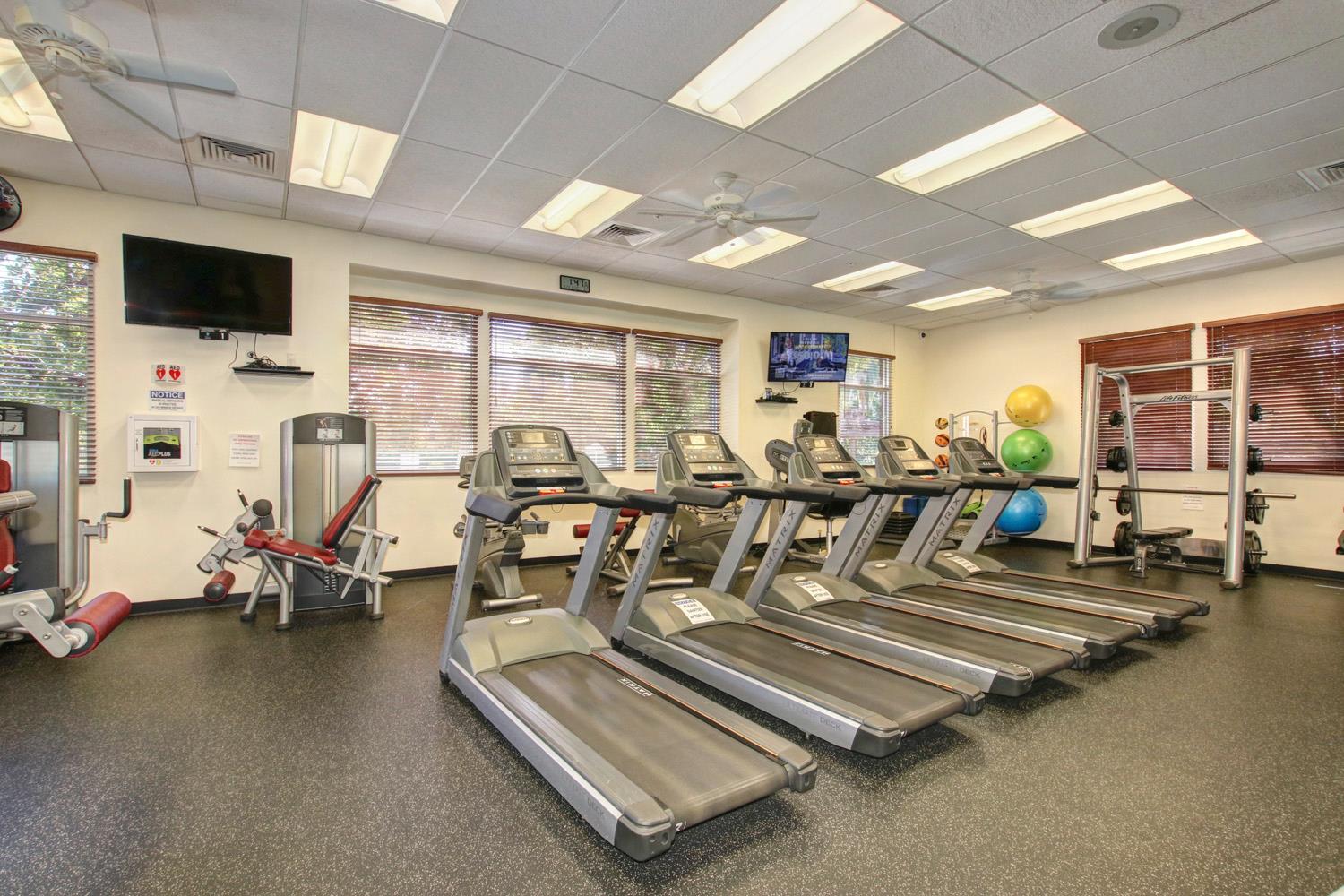 7409 Rothschild Court Elk Grove, CA 95757 - Photo 51 of 62 a view of a room with gym equipment
