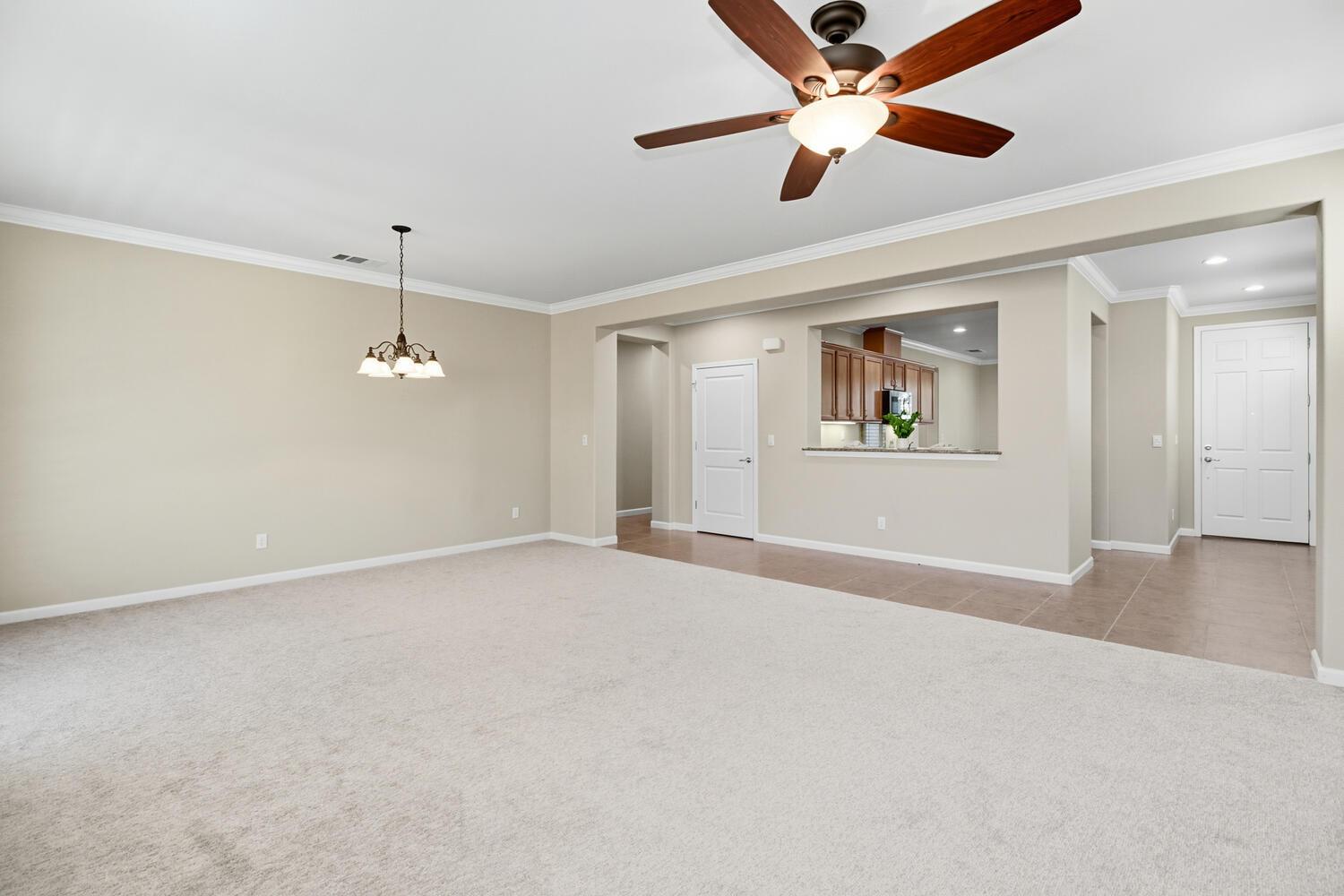 7409 Rothschild Court Elk Grove, CA 95757 - Photo 9 of 62 a view of an empty room with window and ceiling fan