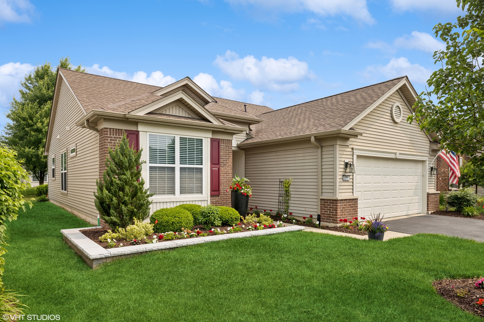 a front view of house with yard and green space