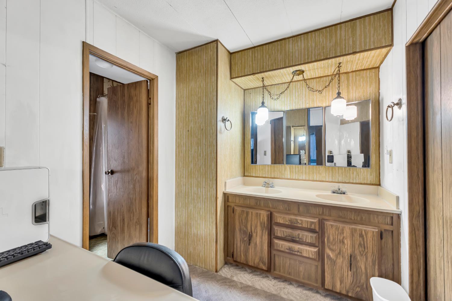 3901 Lake Road, Unit 92 West Sacramento, CA 95691 - Photo 17 of 26 a bathroom with a sink a mirror and a shower