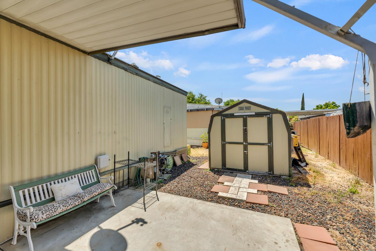 3901 Lake Road, Unit 92 West Sacramento, CA 95691 - Photo 25 of 26 a view of a roof deck with a chair and potted plants