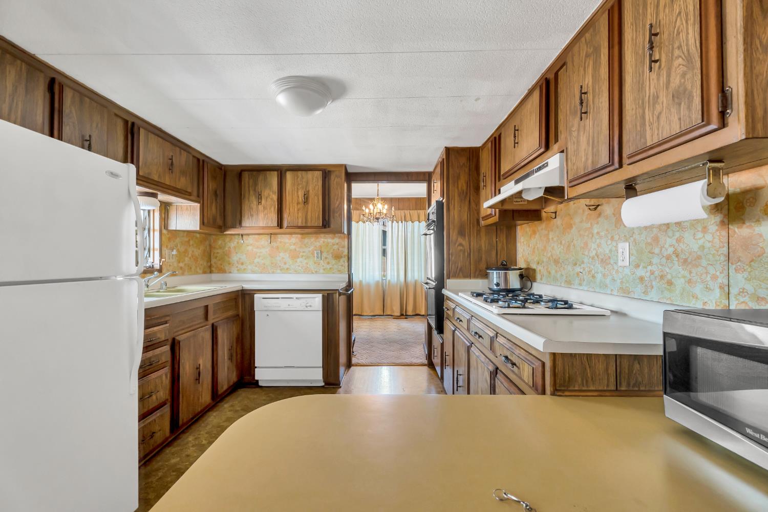3901 Lake Road, Unit 92 West Sacramento, CA 95691 - Photo 5 of 26 a kitchen with stainless steel appliances granite countertop a stove a sink and a refrigerator