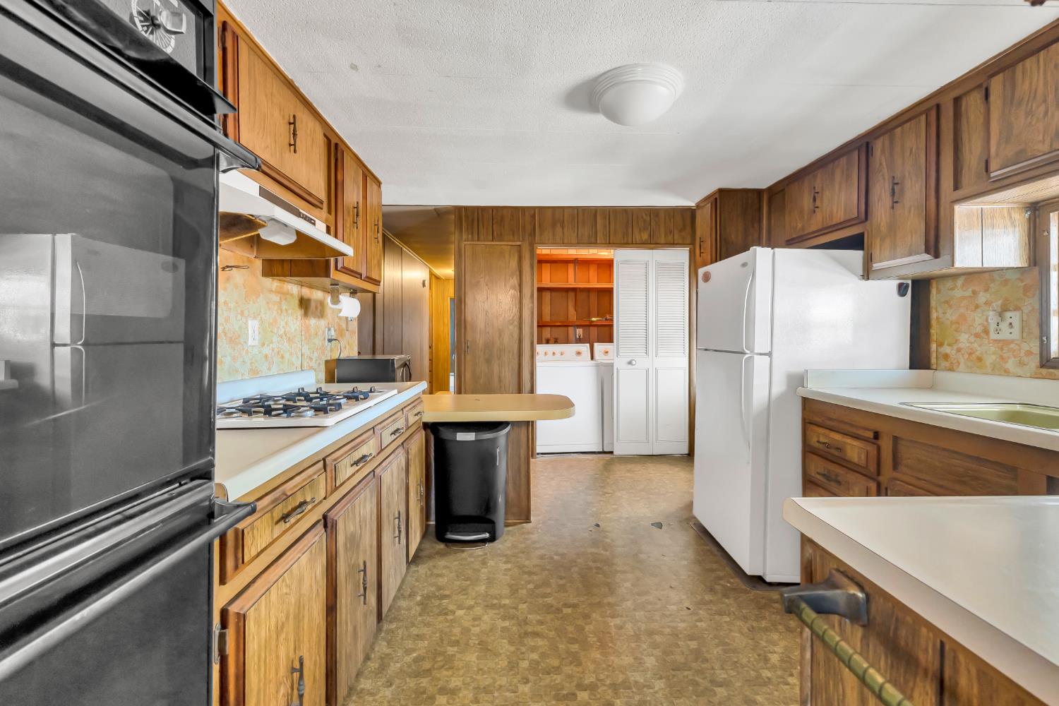 3901 Lake Road, Unit 92 West Sacramento, CA 95691 - Photo 7 of 26 a kitchen with refrigerator a stove and cabinets