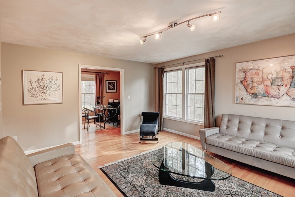 97 Weldon Farm Road Rowley, MA 01969 - Photo 12 of 37 a living room with furniture and wooden floor