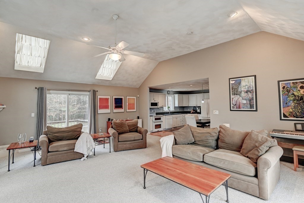 97 Weldon Farm Road Rowley, MA 01969 - Photo 15 of 37 a living room with furniture ceiling fan and a window