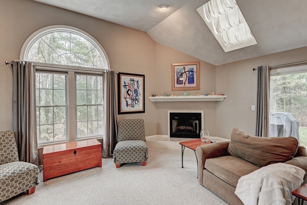 97 Weldon Farm Road Rowley, MA 01969 - Photo 17 of 37 a living room with furniture and a fireplace
