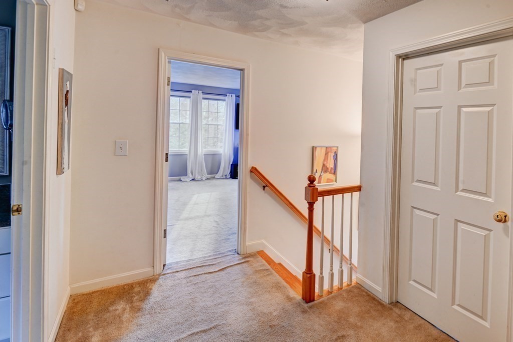 97 Weldon Farm Road Rowley, MA 01969 - Photo 21 of 37 a view of a hallway with staircase