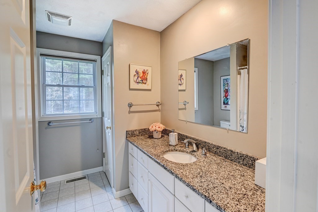 97 Weldon Farm Road Rowley, MA 01969 - Photo 24 of 37 a bathroom with a granite countertop sink and a mirror