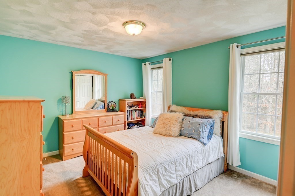 97 Weldon Farm Road Rowley, MA 01969 - Photo 27 of 37 a bedroom with a bed and a dresser