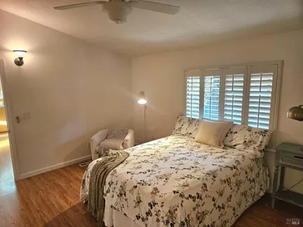 a bed sitting in a bedroom next to a window