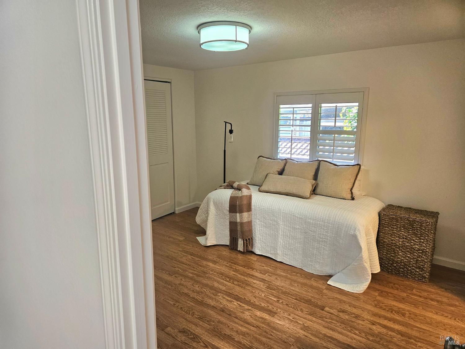 2 San Ardo Court St. Helena, CA 94574 - Photo 16 of 45 a bedroom with a bed and wooden floor