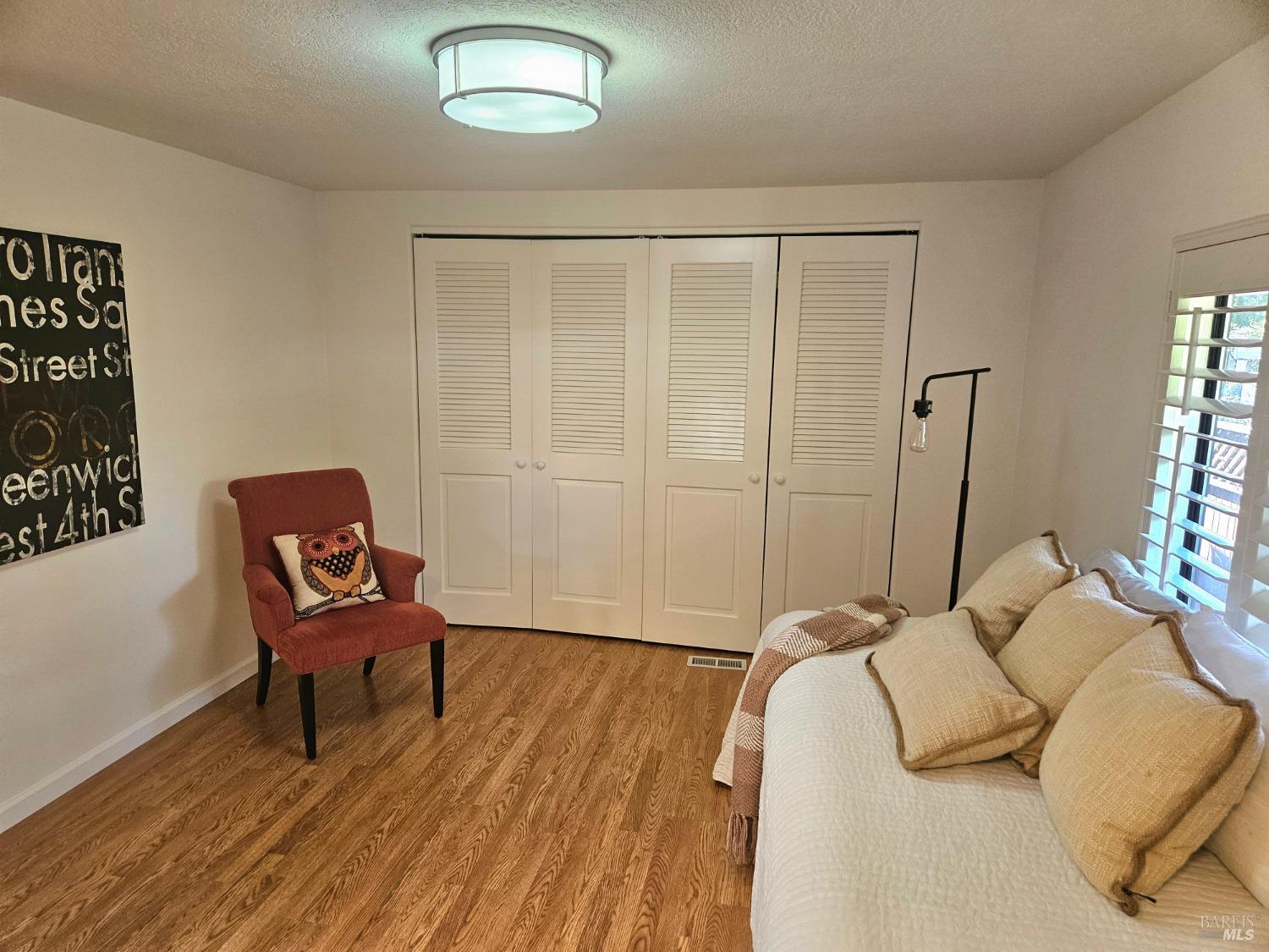 2 San Ardo Court St. Helena, CA 94574 - Photo 17 of 45 a bedroom with a bed and a chair