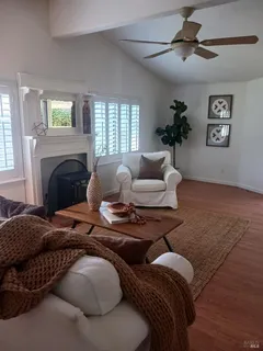 a bedroom with furniture and a fireplace