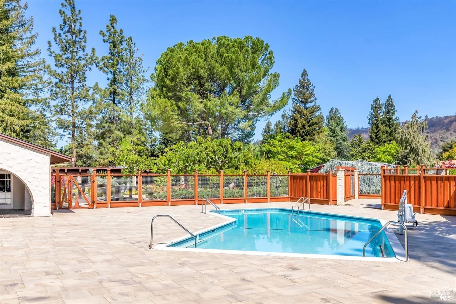 2 San Ardo Court St. Helena, CA 94574 - Photo 42 of 45 a backyard of a house with lots of green space and fountain