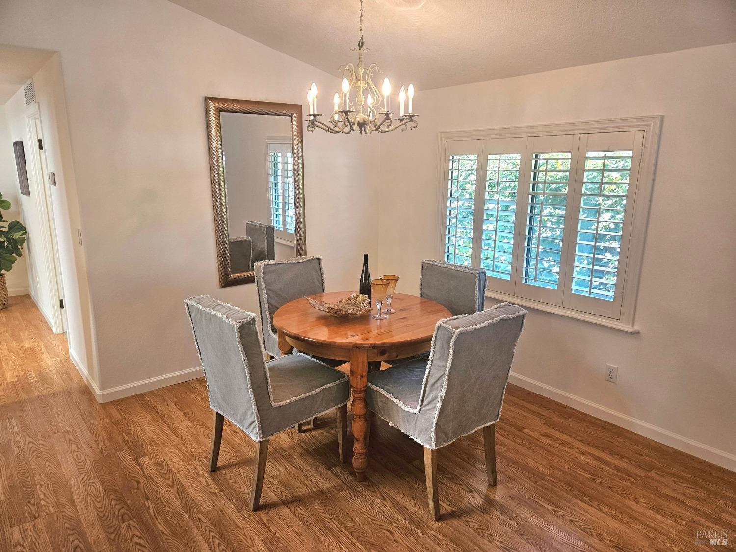 2 San Ardo Court St. Helena, CA 94574 - Photo 7 of 45 a dining room with furniture a chandelier and wooden floor
