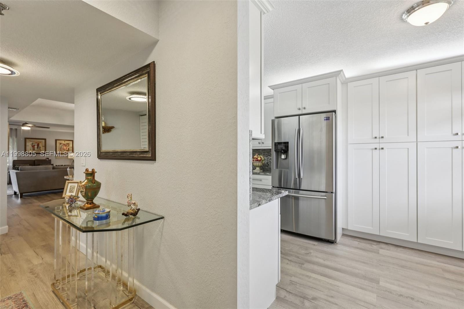 9170 Southwest 14th Street, Unit 4508 Boca Raton, FL 33428 - Photo 16 of 48 a kitchen with kitchen island a counter top space and stainless steel appliances