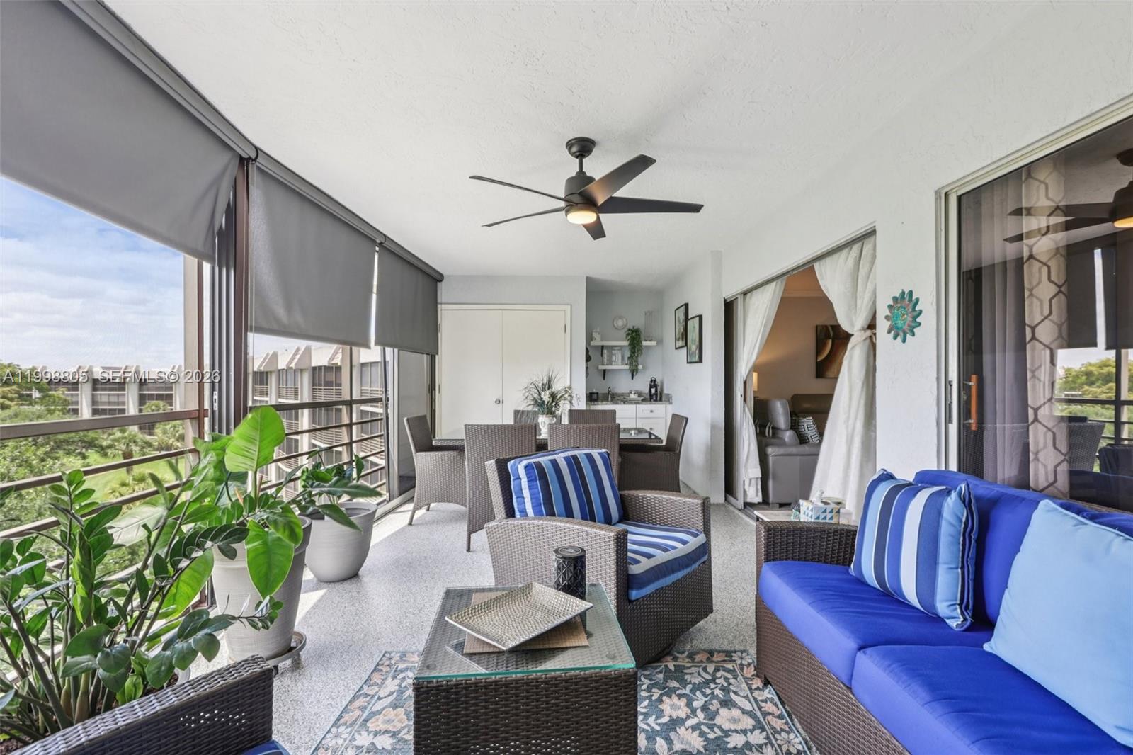 9170 Southwest 14th Street, Unit 4508 Boca Raton, FL 33428 - Photo 2 of 48 a living room with furniture and a large window