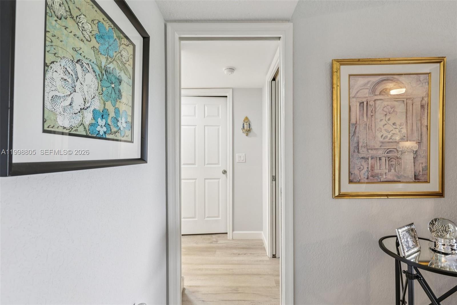 9170 Southwest 14th Street, Unit 4508 Boca Raton, FL 33428 - Photo 26 of 48 a view of a hallway with a painting on the wall