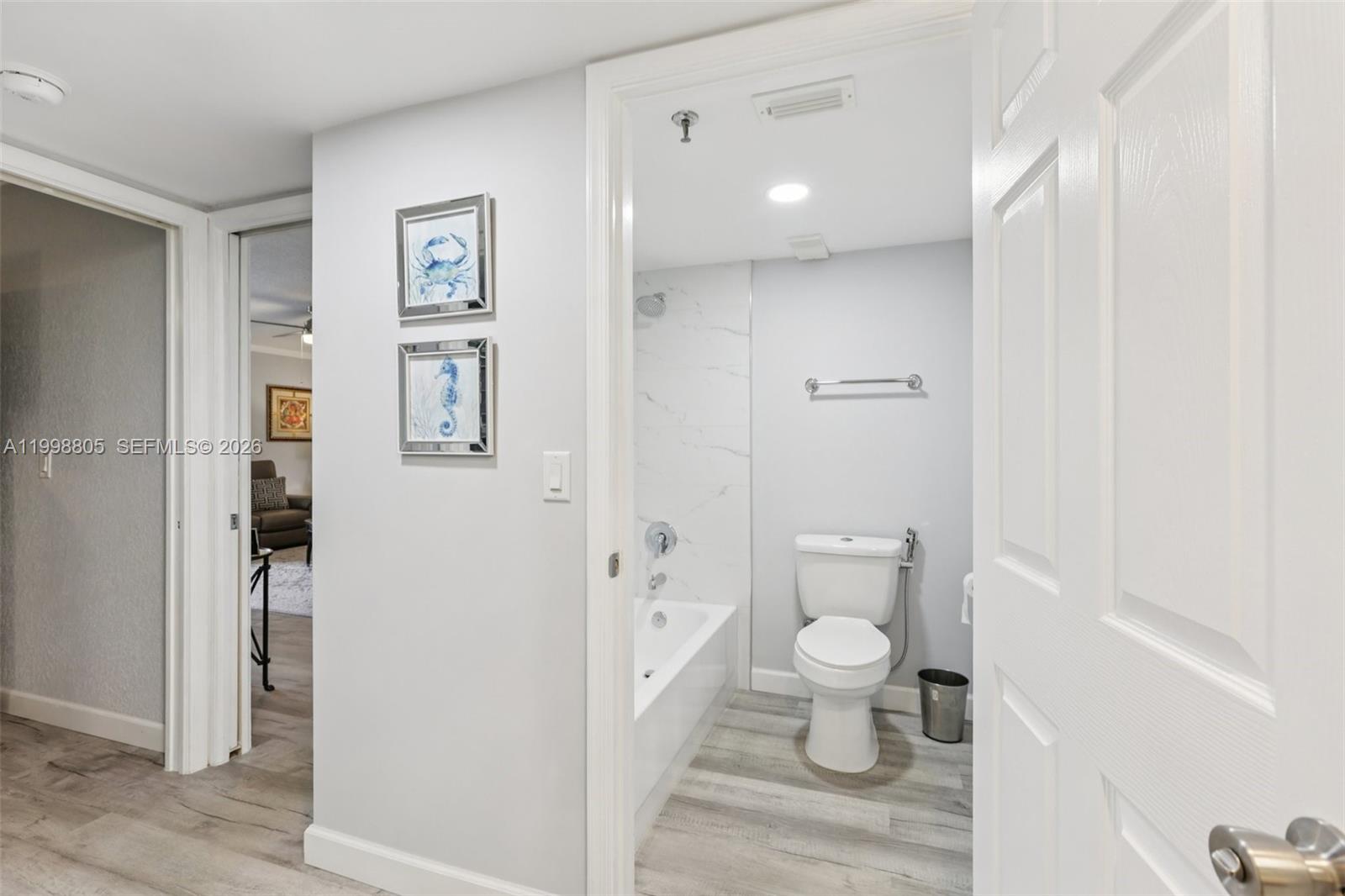 9170 Southwest 14th Street, Unit 4508 Boca Raton, FL 33428 - Photo 33 of 48 a bathroom with a toilet and a shower