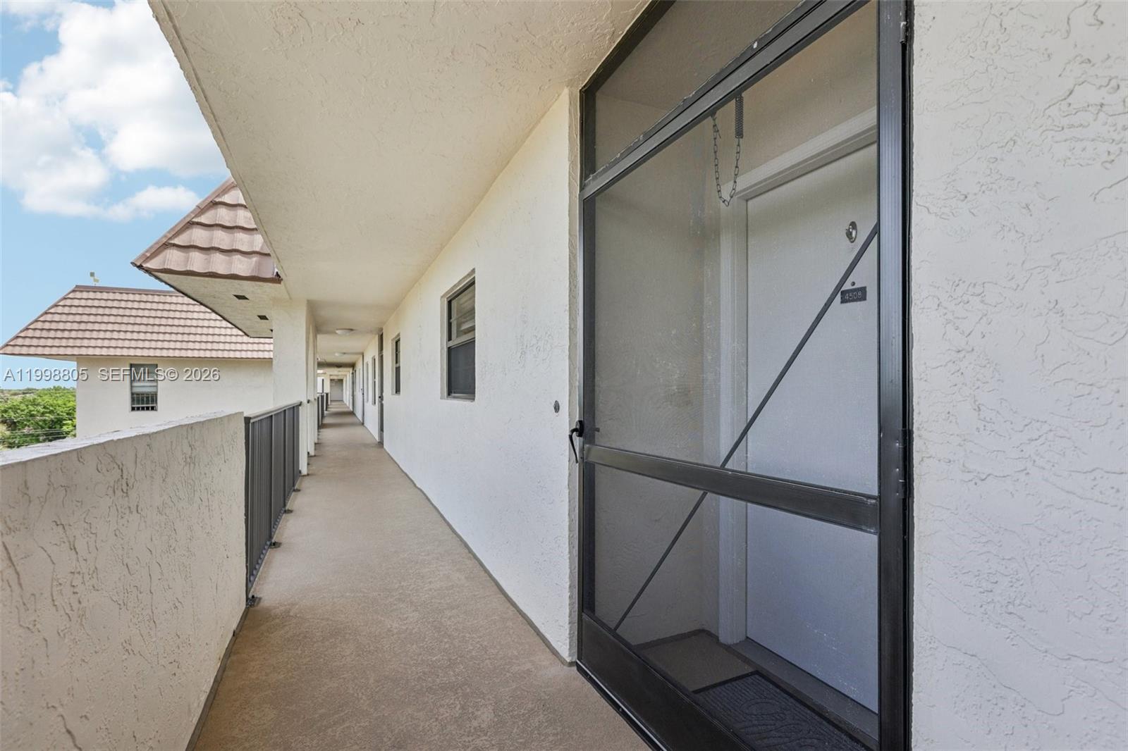 9170 Southwest 14th Street, Unit 4508 Boca Raton, FL 33428 - Photo 34 of 48 a view of a hallway with staircase