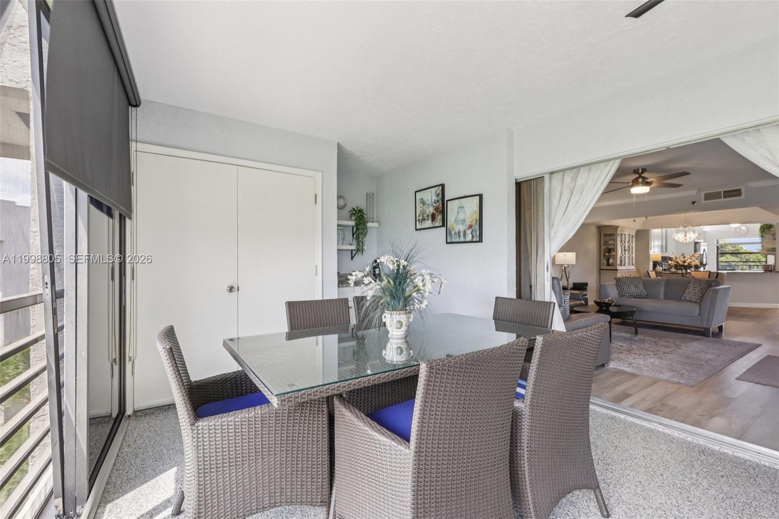 9170 Southwest 14th Street, Unit 4508 Boca Raton, FL 33428 - Photo 36 of 48 a view of a dining room with furniture and wooden floor