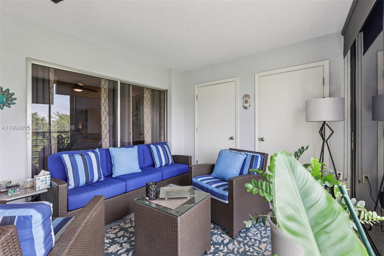 9170 Southwest 14th Street, Unit 4508 Boca Raton, FL 33428 - Photo 37 of 48 a living room with furniture and a large window