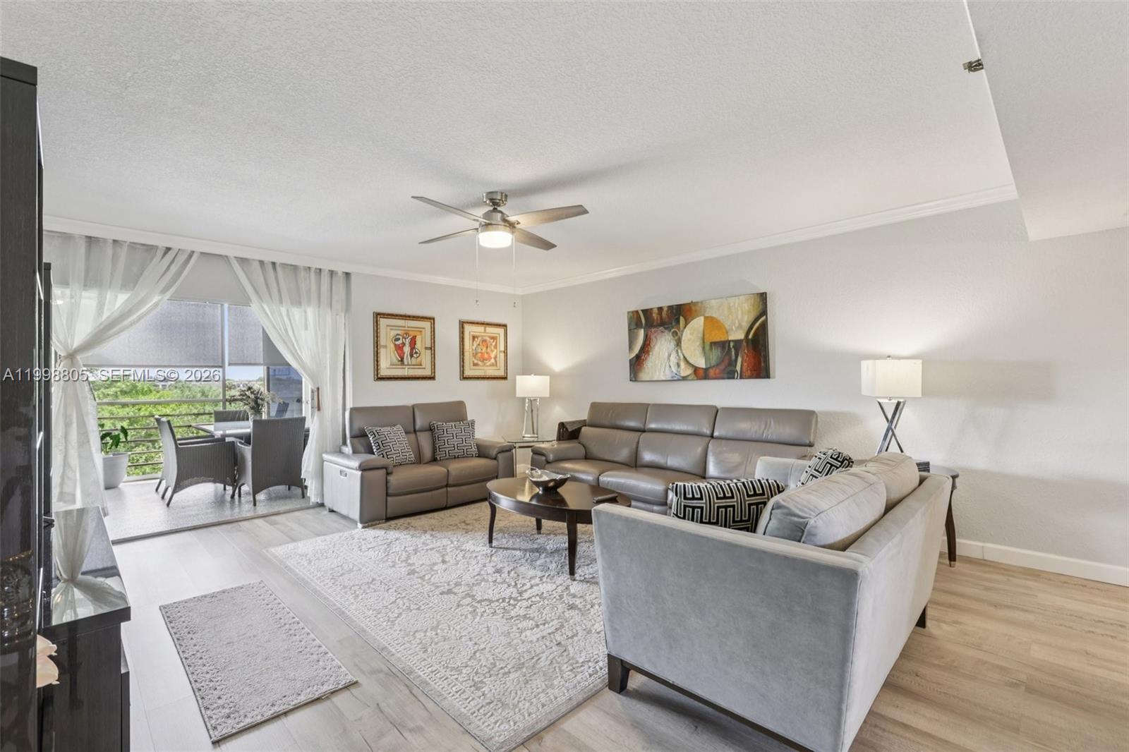 9170 Southwest 14th Street, Unit 4508 Boca Raton, FL 33428 - Photo 10 of 48 a living room with furniture and a large window