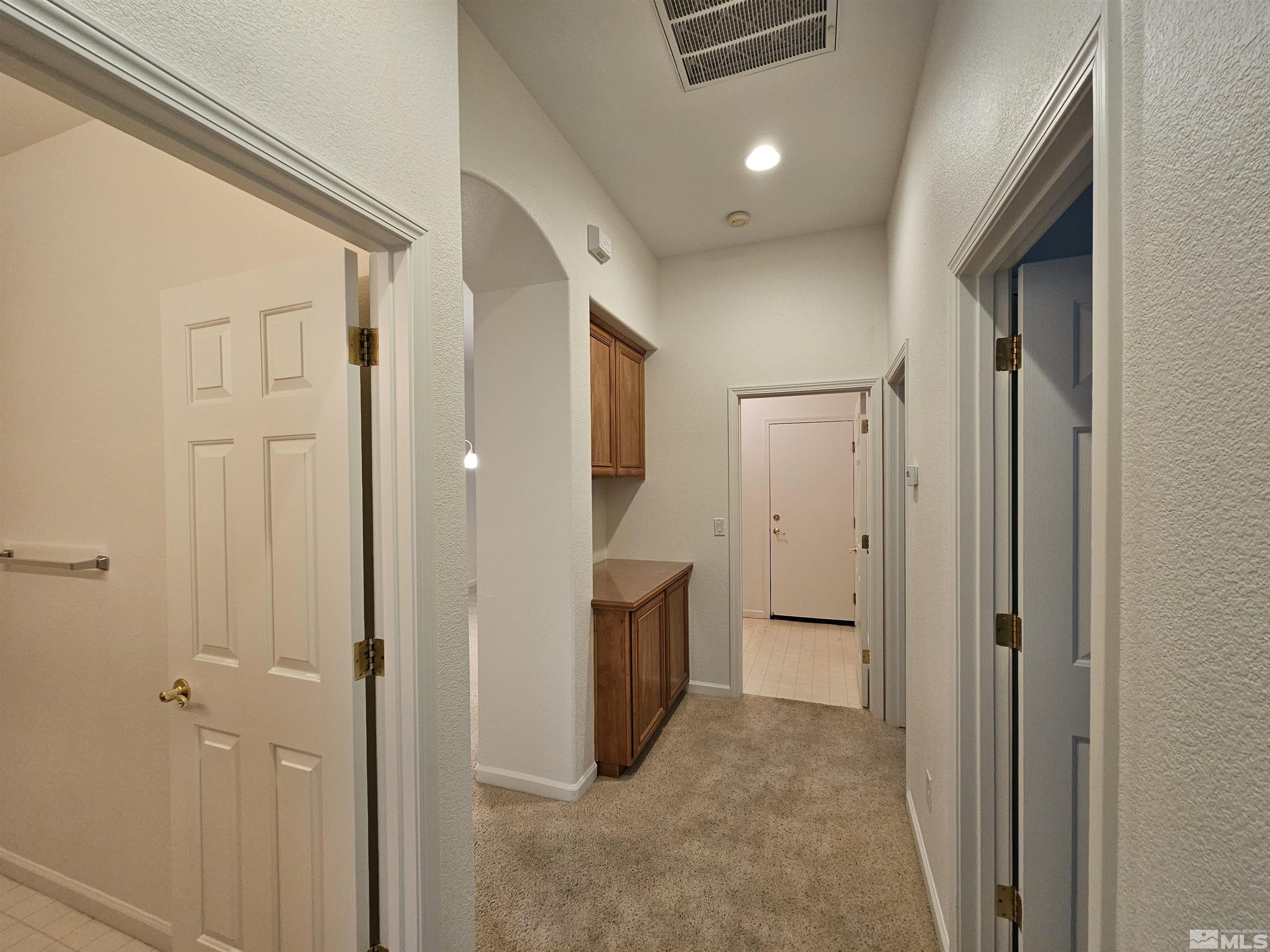 10575 Moss Wood Court Reno, NV 89521 - Photo 25 of 40 a view of a hallway with a bathroom