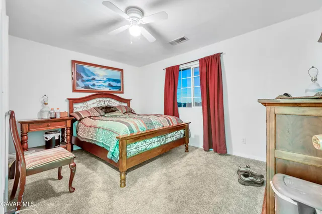 a bathroom with a sink toilet vanity and tub