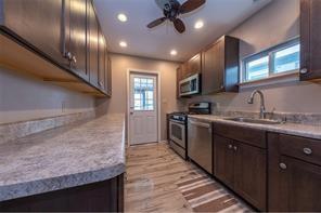 88 Evans Avenue Pittsburgh, PA 15205 - Photo 16 of 41 a kitchen with kitchen island granite countertop stainless steel appliances lots of counter top space cabinets and a sink