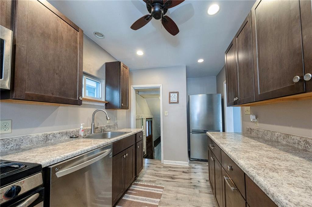 88 Evans Avenue Pittsburgh, PA 15205 - Photo 18 of 41 a kitchen with granite countertop stainless steel appliances a sink stove and cabinets
