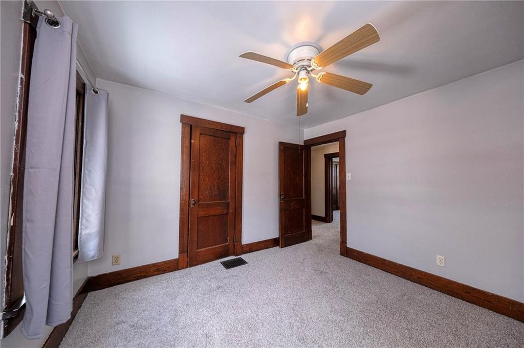 88 Evans Avenue Pittsburgh, PA 15205 - Photo 25 of 41 an empty room with closet and a chandelier fan