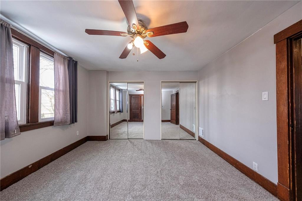 88 Evans Avenue Pittsburgh, PA 15205 - Photo 33 of 41 a view of an empty room with chandelier fan and windows