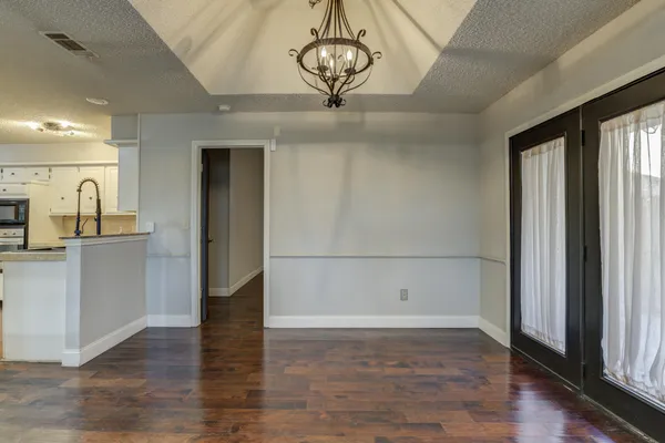 a view of a livingroom with wooden floor