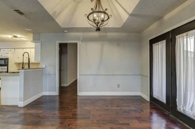a view of a livingroom with wooden floor