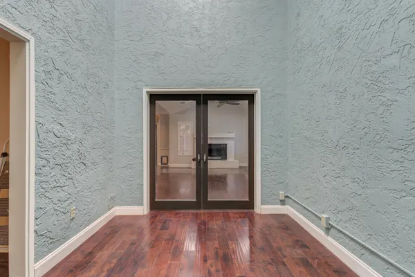 a view of hallway with wooden floor