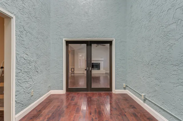 a view of hallway with wooden floor
