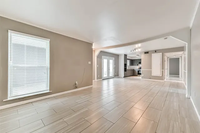 a view of livingroom with furniture and an entryway