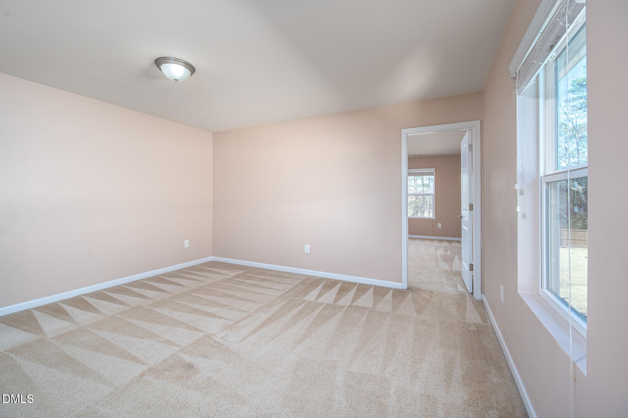 3548 Althorp Drive Raleigh, NC 27616 - Photo 19 of 56 a view of an empty room with window and closet area