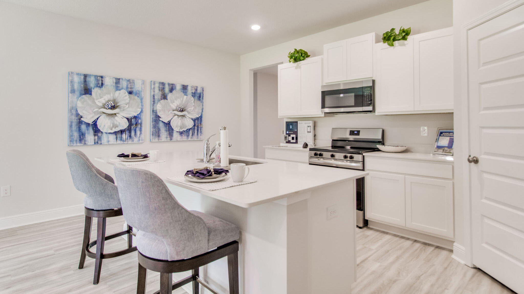 31 Foxtrail Run Freeport, FL 32439 - Photo 2 of 31 a kitchen with stainless steel appliances a sink a stove a table and chairs