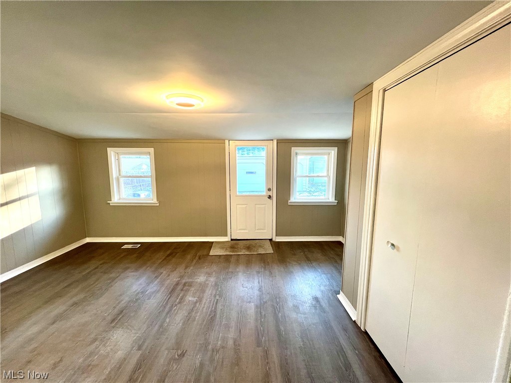 3527 Broadview Road Cleveland, OH 44109 - Photo 14 of 29 Empty room featuring dark hardwood / wood-style floors and plenty of natural light