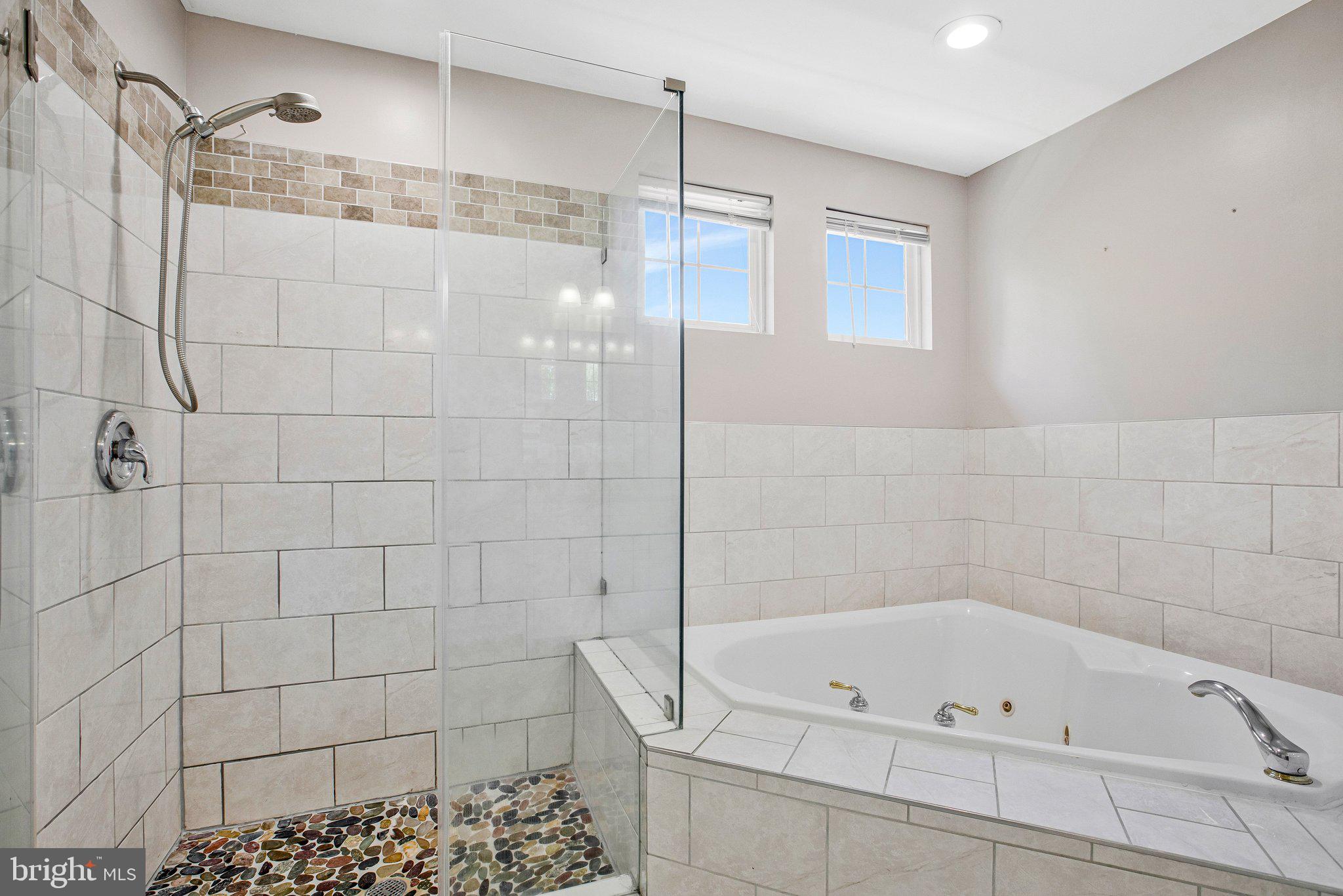 13215 Falls Road Cockeysville, MD 21030 - Photo 14 of 40 a bathroom with a bathtub and shower