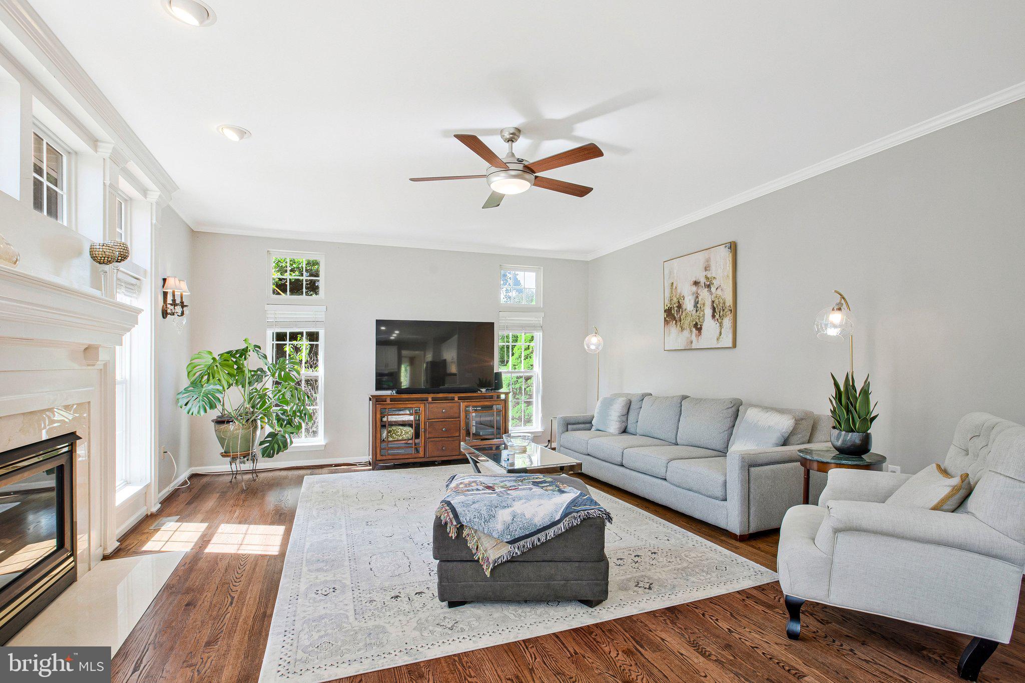 13215 Falls Road Cockeysville, MD 21030 - Photo 7 of 40 a living room with furniture a flat screen tv and a fireplace