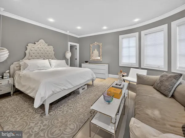 a spacious bedroom with a bed and window