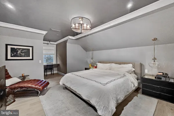 a bedroom with bed and a window