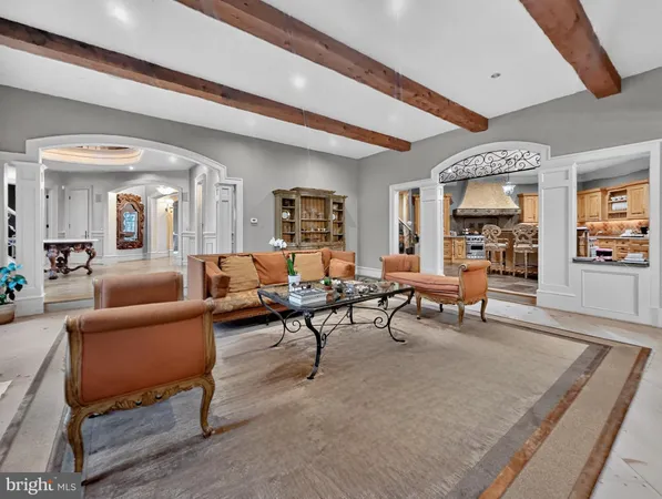 a living room with furniture and a dining table
