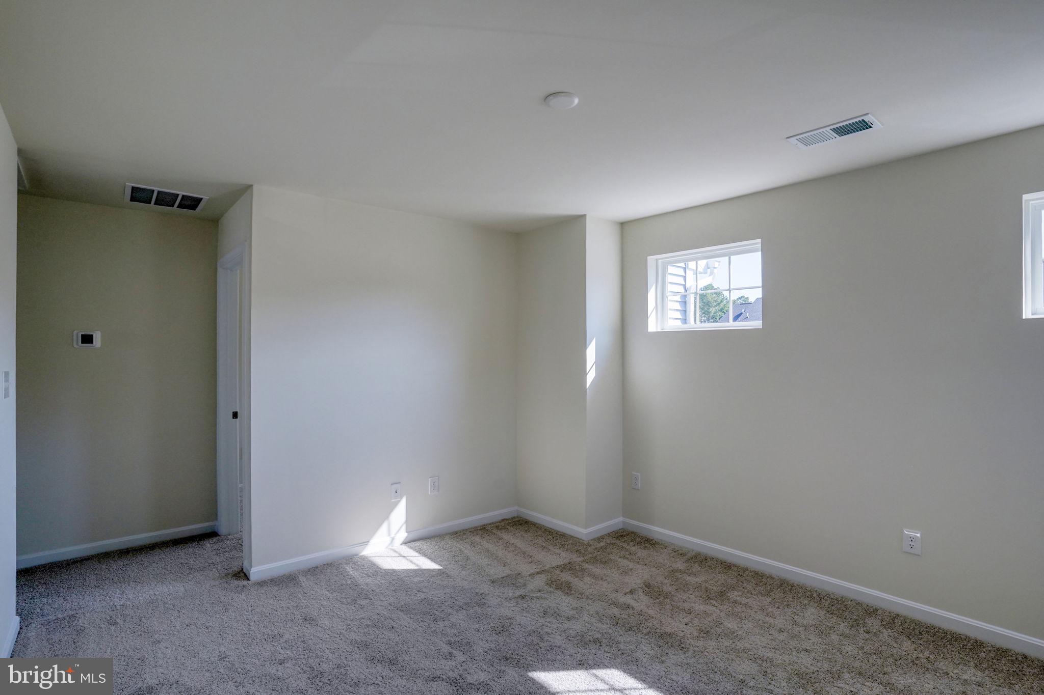 33828 Coldstream Street Frankford, DE 19945 - Photo 25 of 48 an empty room with windows