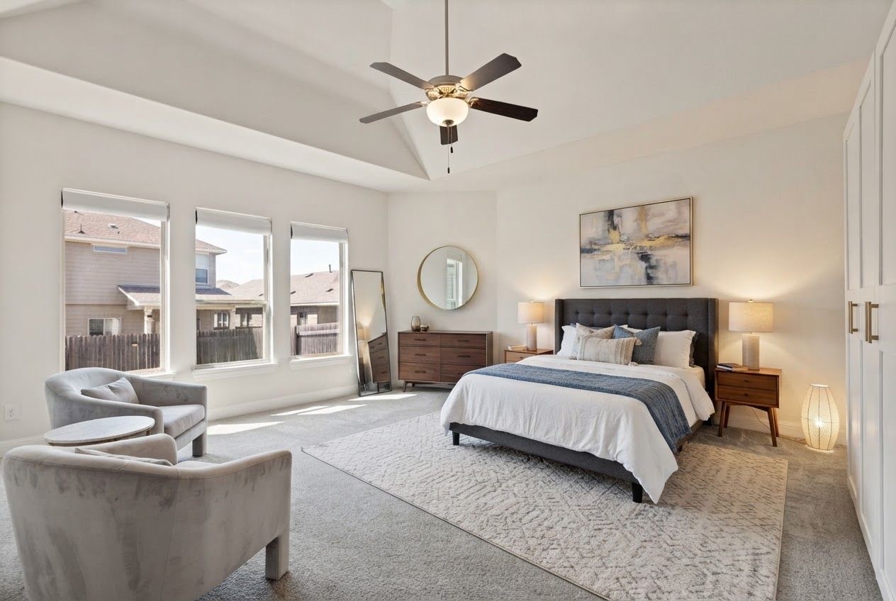727 Spinnaker Loop Kyle, TX 78640 - Photo 11 of 29 High vaulted ceilings and tall windows elevate this serene, carpeted bedroom retreat.